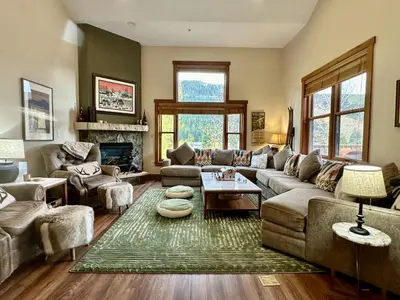a living room with a couch and a fireplace at 2348 Red Hawk Townhomes condo in Keystone
