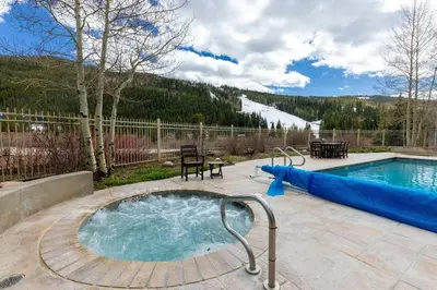 a swimming pool with a blue inflatable at 2348 Red Hawk Townhomes condo in Keystone