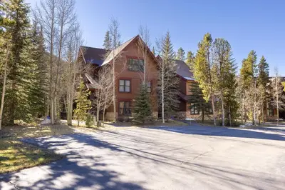 a large house with a driveway in front of it at 8767 Trappers Crossing condo in Keystone