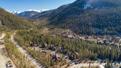 an aerial view of a village in the mountains at 8767 Trappers Crossing condo in Keystone