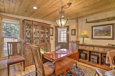 a dining room with a wooden table and chairs at 6 Mi to Slopes! Mtn-View Breck Gem with Resort Perks in Breckenridge