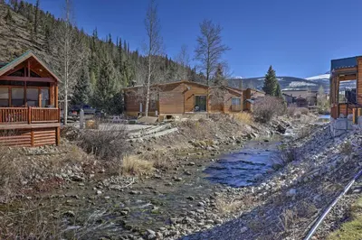 a river in front of a log cabin at 6 Mi to Slopes! Mtn-View Breck Gem with Resort Perks in Breckenridge