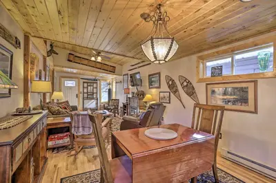 a dining room and living room in a tiny house at 6 Mi to Slopes! Mtn-View Breck Gem with Resort Perks in Breckenridge