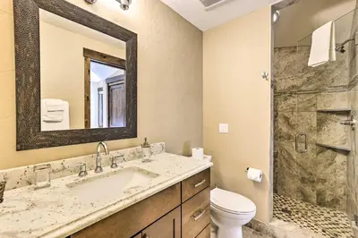 a bathroom with a sink and a toilet and a shower at 3 Fireplaces and Mtn View Luxe Home in Breckenridge in Breckenridge