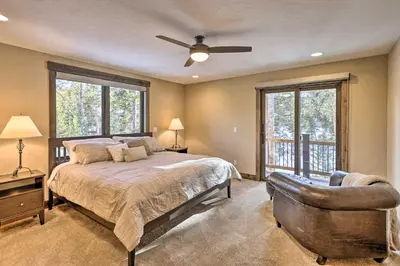 a bedroom with a bed and a ceiling fan at 3 Fireplaces and Mtn View Luxe Home in Breckenridge in Breckenridge
