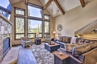 a living room with a couch and a fireplace at 3 Fireplaces and Mtn View Luxe Home in Breckenridge in Breckenridge