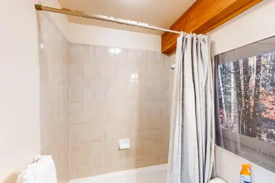 a bathroom with a shower with a shower curtain at Crescent Moon Sanctuary in Silverthorne