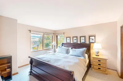a bedroom with a large bed and a window at Crescent Moon Sanctuary in Silverthorne