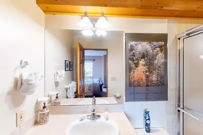 a bathroom with a sink and a mirror at Crescent Moon Sanctuary in Silverthorne