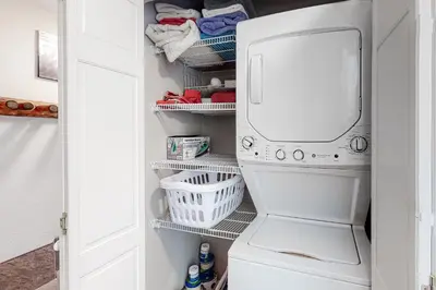 a laundry room with a washer and dryer at Wildernest Rest in Silverthorne