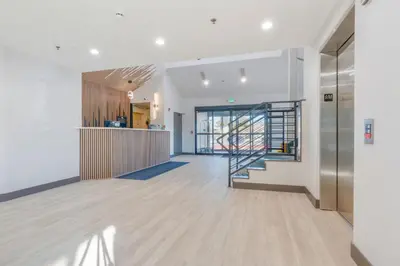a hallway with a staircase in a building at Days Inn by Wyndham Thornton in Thornton