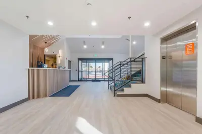 a hallway with a staircase in a building at Days Inn by Wyndham Thornton in Thornton