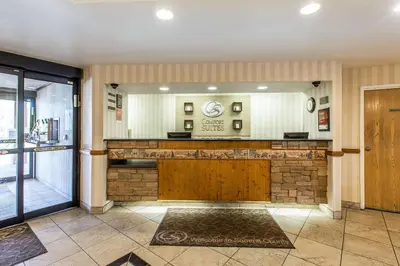 a hotel lobby with a large mirror and a bar at Comfort Suites Summit County in Dillon