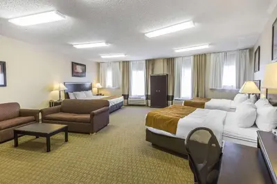 a hotel room with two beds and a couch at Comfort Suites Summit County in Dillon