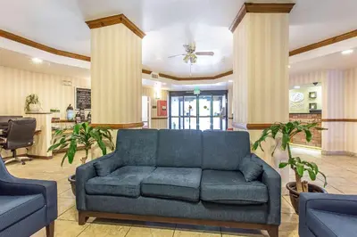 a living room with a couch and two chairs at Comfort Suites Summit County in Dillon