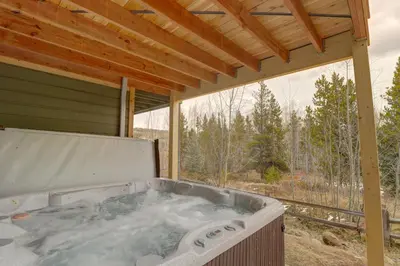 a hot tub sitting under a pergola at Prospector Point E 4Br 3,5Ba townhouse in Frisco