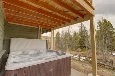 a hot tub sitting on the porch of a house at Prospector Point E 4Br 3,5Ba townhouse in Frisco