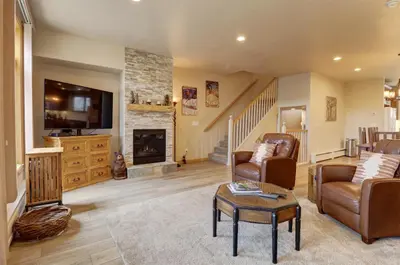 a living room with a couch and a fireplace at Prospector Point E 4Br 3,5Ba townhouse in Frisco