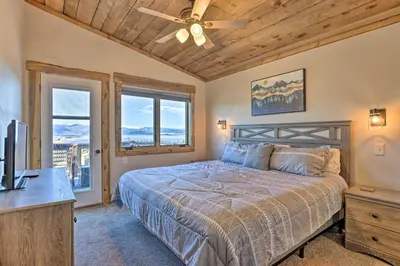 a bedroom with a bed and a ceiling fan at Balconies and Idyllic Views Grand Lake Haven! in Grand Lake