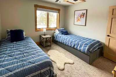 a bedroom with two beds and a window at Balconies and Idyllic Views Grand Lake Haven! in Grand Lake