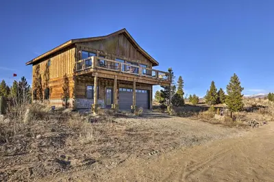 an old wooden house on the side of a dirt road at Balconies and Idyllic Views Grand Lake Haven! in Grand Lake