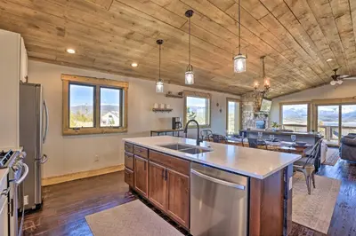 a kitchen with a sink and a counter top at Balconies and Idyllic Views Grand Lake Haven! in Grand Lake