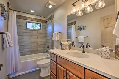 a bathroom with a sink and a tub and a toilet at Balconies and Idyllic Views Grand Lake Haven! in Grand Lake