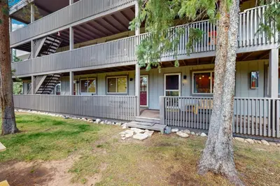 a house with a porch and stairs on it at Hi Country Haus 14-5 in Winter Park