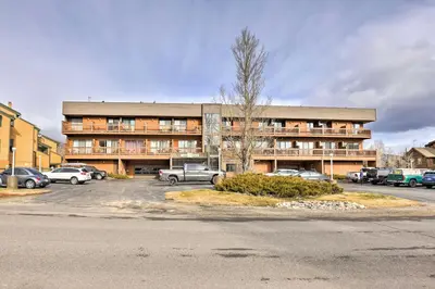 a large building with cars parked in a parking lot at Walk to Main St Frisco! Modern Unit 7 Mi to Slopes in Frisco
