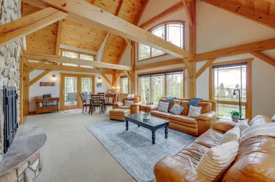 a large living room with leather furniture and wooden ceilings at 7 Mi to Rocky Mtn Natl Park Grand Lake Home! in Grand Lake