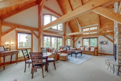 a large living room with wooden ceilings and windows at 7 Mi to Rocky Mtn Natl Park Grand Lake Home! in Grand Lake