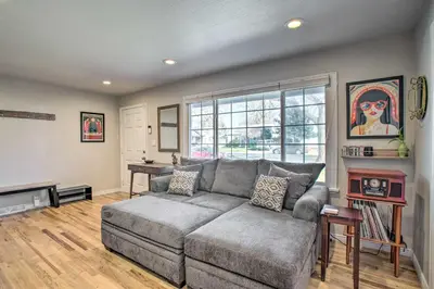 a living room with a couch and a window at Centrally Located Aurora Home with Covered Patio in Aurora