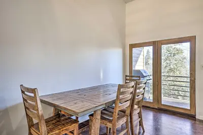 a dining room with a wooden table and chairs at Hot Tub and Mtn Views Silverthorne Escape! in Silverthorne