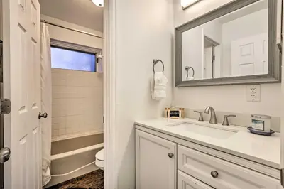 a bathroom with a sink and a mirror at Hot Tub and Mtn Views Silverthorne Escape! in Silverthorne