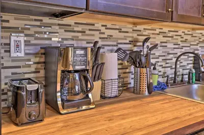 a kitchen counter with a coffee maker on a counter top at 2 Mi to Skiing Studio with Pool Access in Granby! in Granby