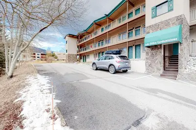 a car parked in a parking lot in front of a building at Lakeside Mountain Retreat in Dillon