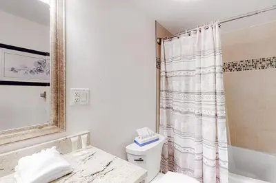 a bathroom with a toilet and a shower at Lakeside Mountain Retreat in Dillon