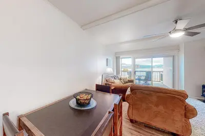 a living room with a table and a couch at Lakeside Mountain Retreat in Dillon