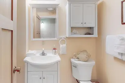 a bathroom with a white sink and a toilet at Lakeside Mountain Retreat in Dillon
