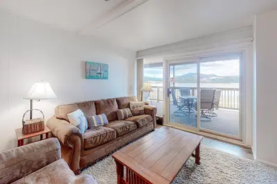 a living room with a couch and a table at Lakeside Mountain Retreat in Dillon