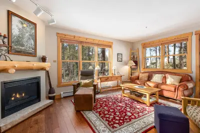 a living room with a couch and a fireplace at 8758 Trappers Crossing condo in Dillon