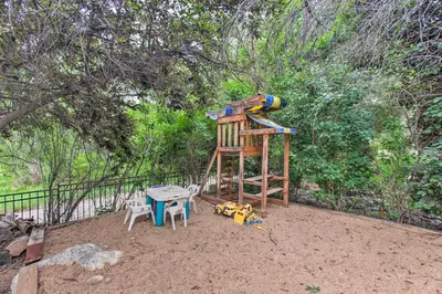 a childrens playground with a table and a play structure at Green Valley Ranch - Family Home 13 Mins to DIA in Denver