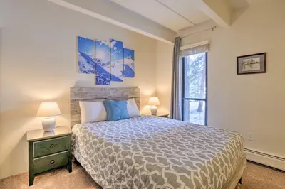 a bedroom with a large bed and a window at 1 Mi to Dillon Reservoir Condo Retreat in Frisco! in Frisco