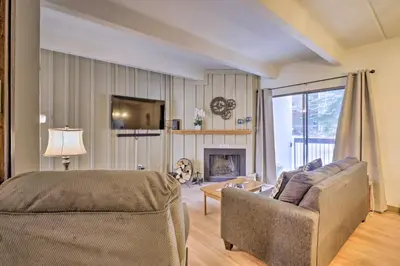 a living room with a couch and a fireplace at 1 Mi to Dillon Reservoir Condo Retreat in Frisco! in Frisco