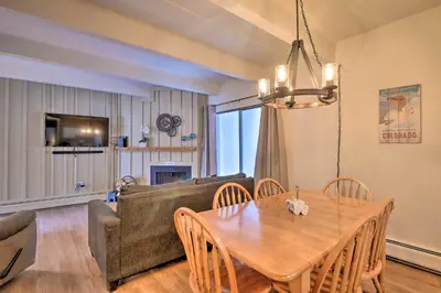 a living room with a table and a couch at 1 Mi to Dillon Reservoir Condo Retreat in Frisco! in Frisco