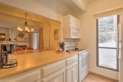 a kitchen with a counter top and a window at 1 Mi to Dillon Reservoir Condo Retreat in Frisco! in Frisco