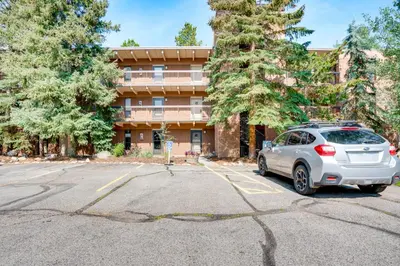 a car parked in a parking lot in front of a building at 1 Mi to Dillon Reservoir Condo Retreat in Frisco! in Frisco