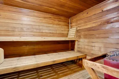 a wooden sauna with a bench in it at 1 Mi to Dillon Reservoir Condo Retreat in Frisco! in Frisco