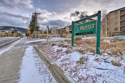 an empty street with a sign in the snow at 7 Mi to Keystone Resort Condo with Hot Tub and Pool in Dillon
