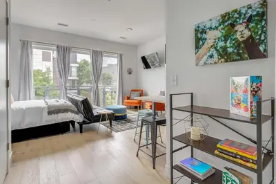 a bedroom with a bed and a desk at Downtown Denver Studio Less Than 1 Mi to Coors Field! in Denver